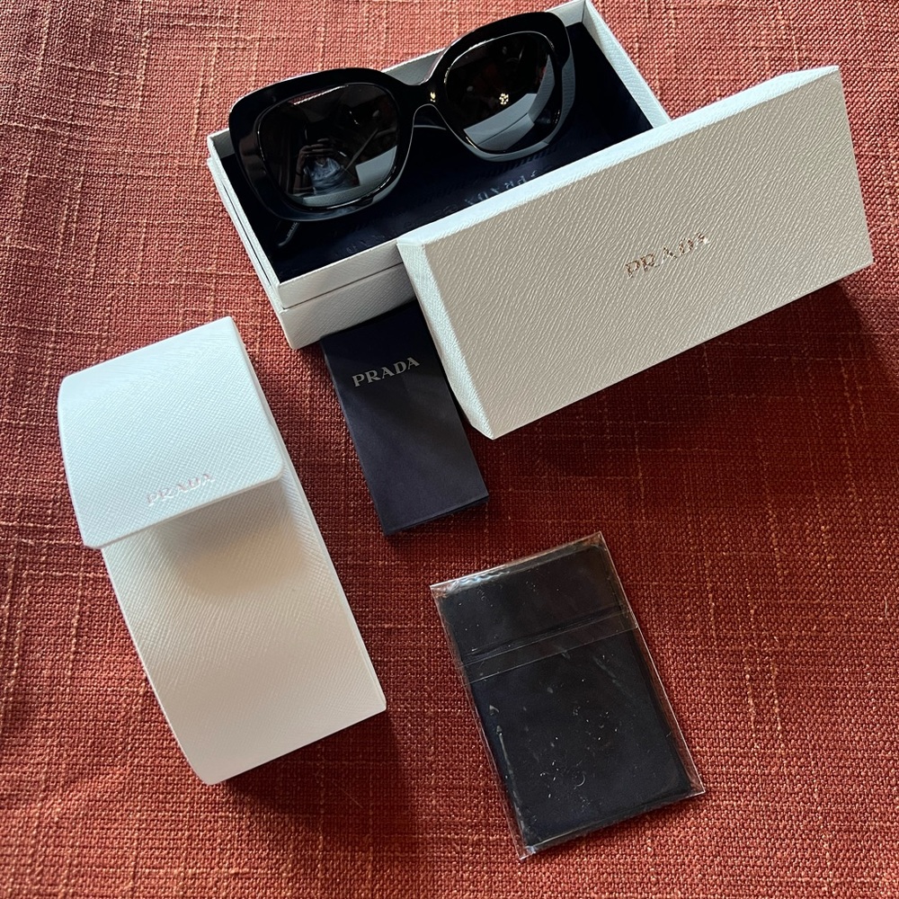 Prada authentic new sunglasses with cleaning cloth carrying case and box